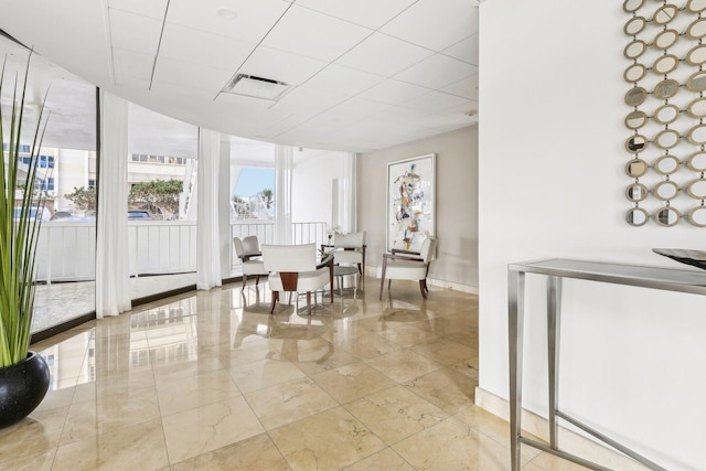 living area with floor to ceiling windows