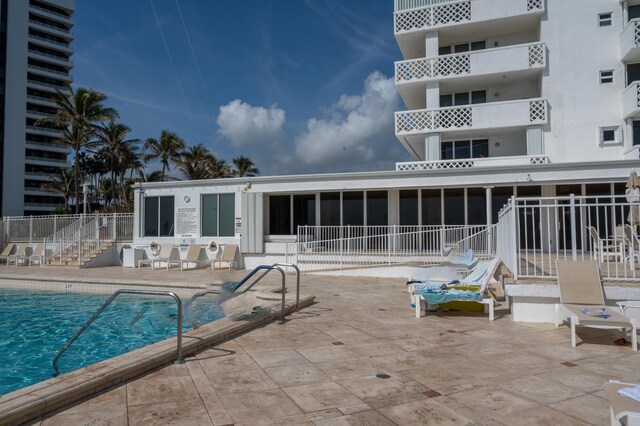 view of swimming pool featuring a patio area