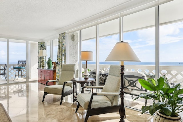 sunroom with a water view