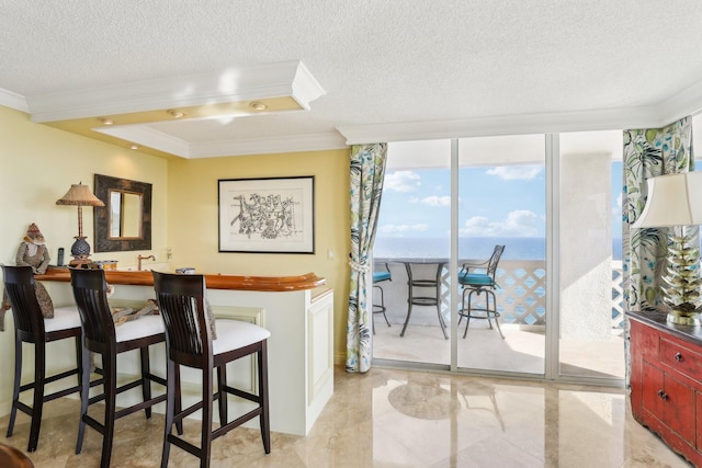 interior space with crown molding, floor to ceiling windows, and a textured ceiling