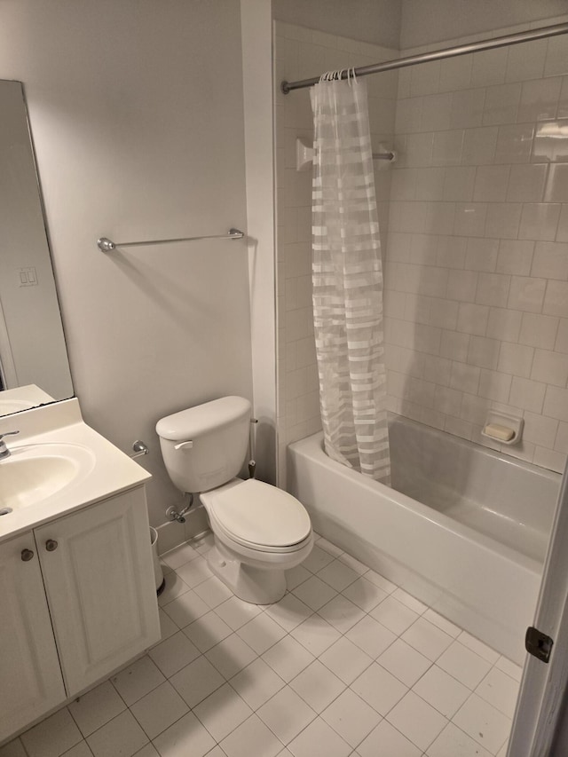 bathroom with toilet, shower / bath combo with shower curtain, vanity, and tile patterned floors