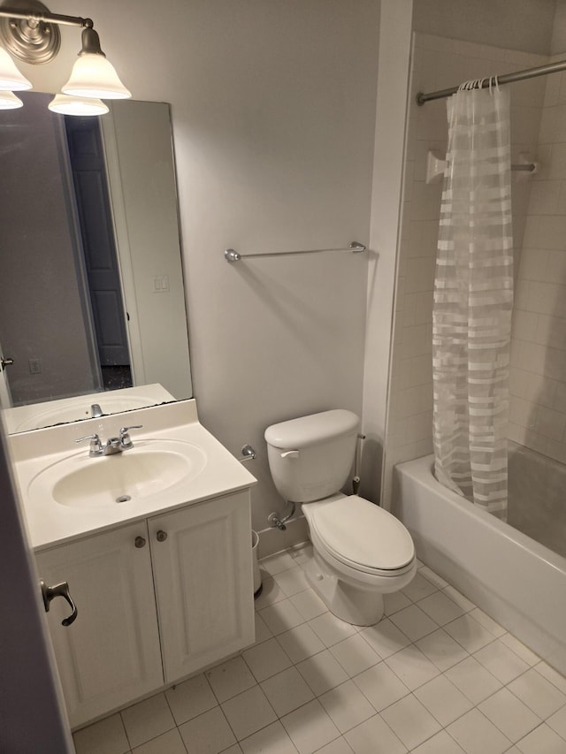 full bath with tile patterned flooring, shower / tub combo with curtain, vanity, and toilet