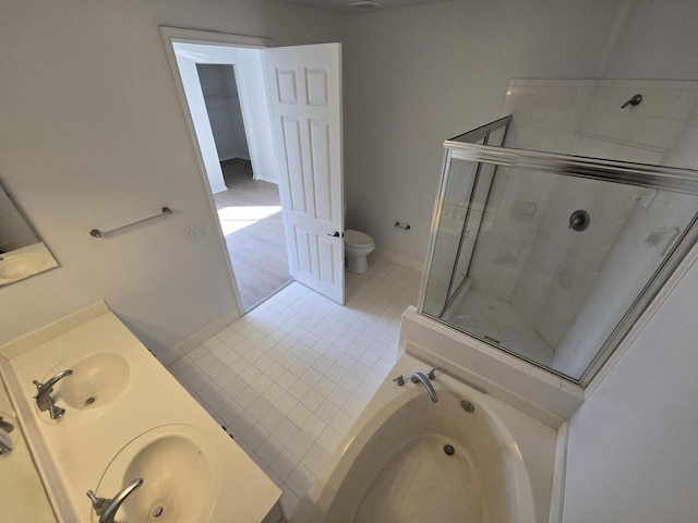 full bathroom with double vanity, toilet, a garden tub, tile patterned flooring, and a shower stall