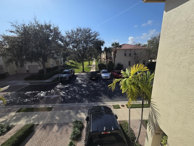 exterior space featuring sidewalks and a residential view