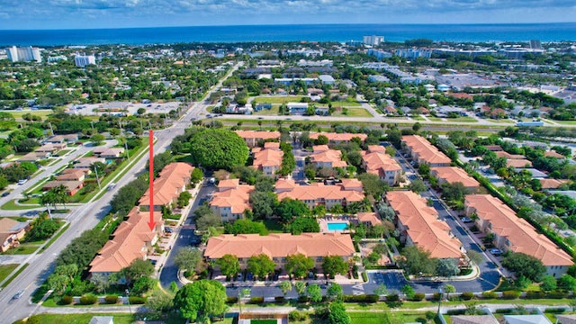 birds eye view of property with a water view and a residential view