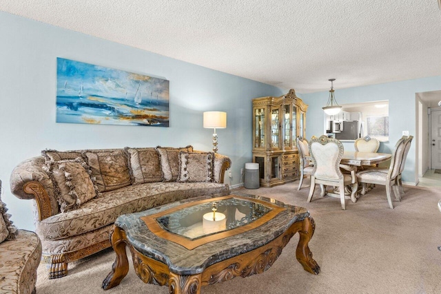 living room with light carpet and a textured ceiling