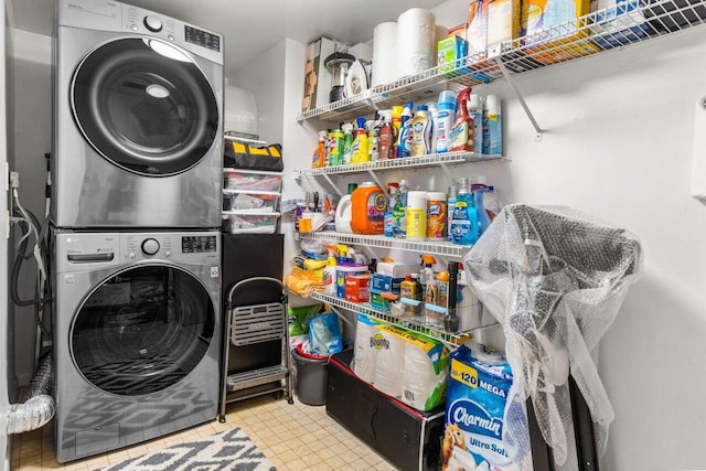 laundry area with stacked washing maching and dryer