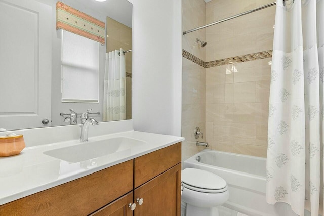 full bathroom featuring vanity, shower / tub combo, and toilet