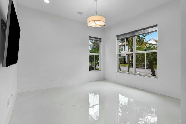 spare room with tile patterned floors