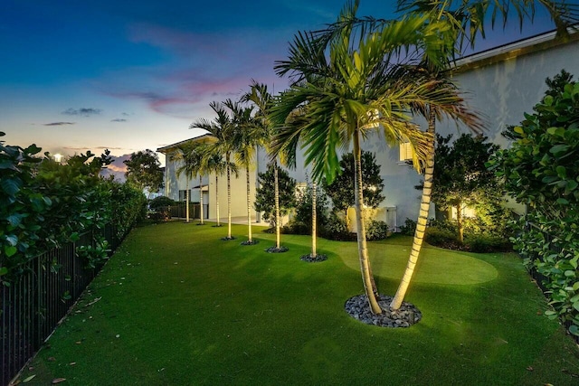 view of yard at dusk