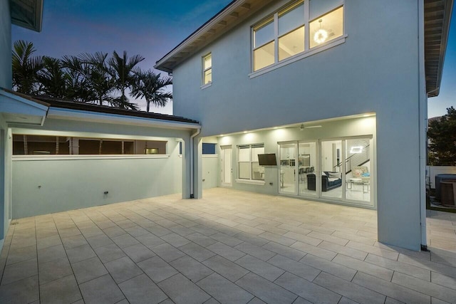 exterior space with central AC unit and a patio area