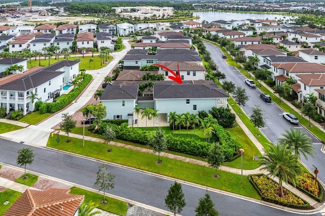 drone / aerial view with a water view