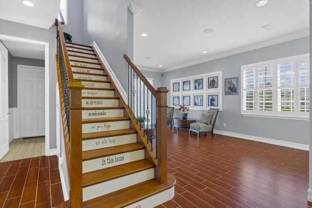 stairway featuring ornamental molding