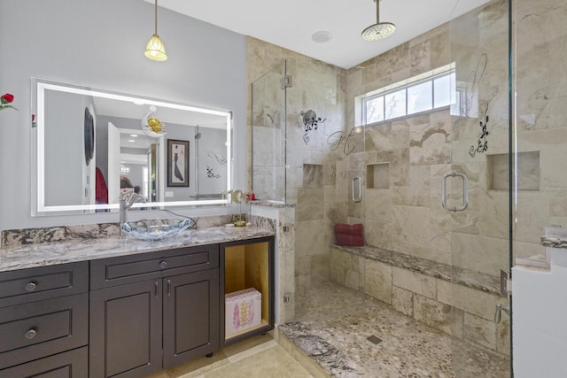 bathroom with vanity and walk in shower