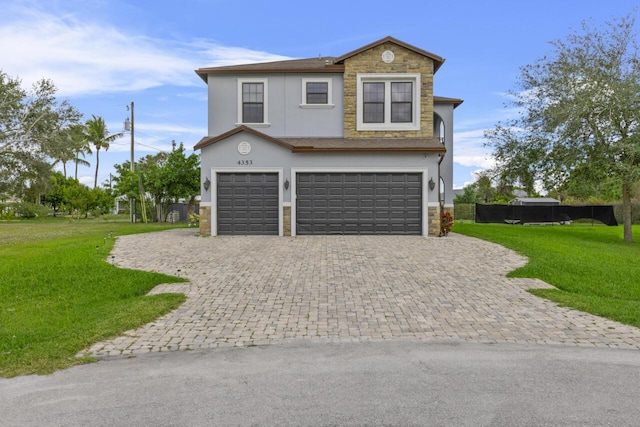 view of front facade featuring a garage and a front yard