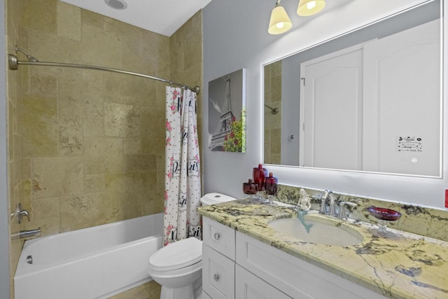 full bathroom featuring shower / tub combo, vanity, and toilet