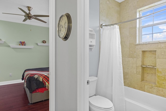 bathroom with shower / bathtub combination with curtain, crown molding, ceiling fan, hardwood / wood-style floors, and toilet