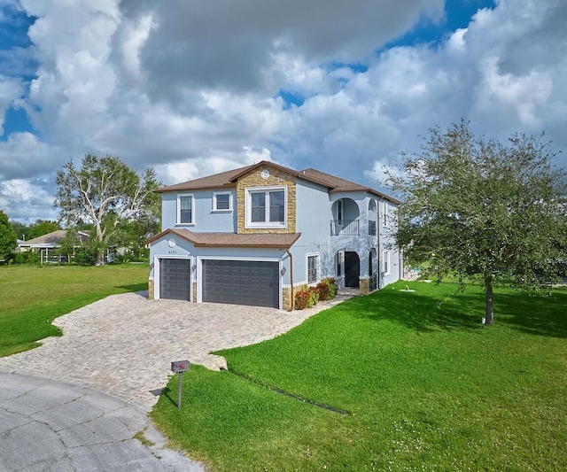 view of front of house with a garage and a front yard