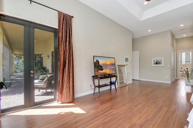 living room with hardwood / wood-style floors and french doors