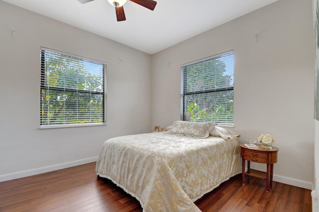 bedroom with dark wood-type flooring and ceiling fan