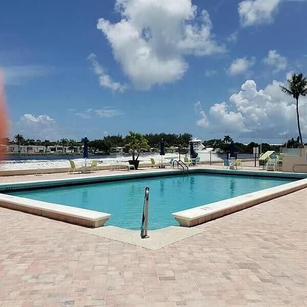 view of swimming pool featuring a patio