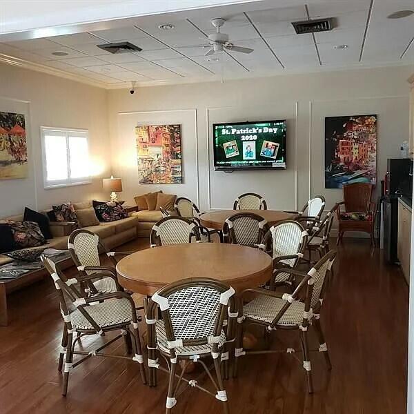 dining space featuring crown molding, ceiling fan, and dark hardwood / wood-style floors