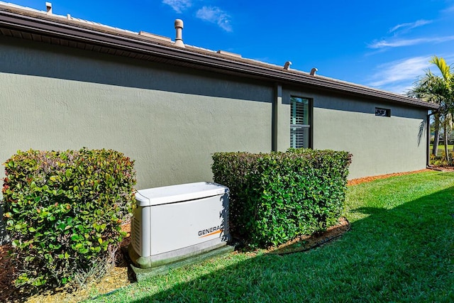 view of side of home featuring a yard