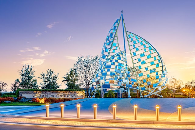 view of outdoor building at dusk