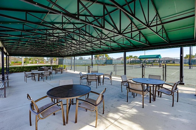 view of patio with tennis court