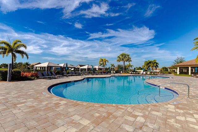 view of swimming pool with a patio area