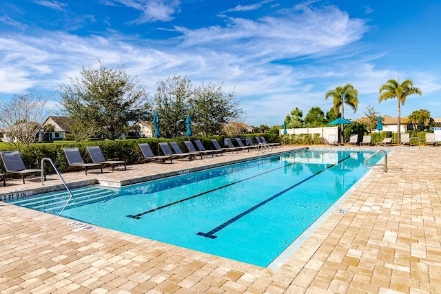 view of pool featuring a patio