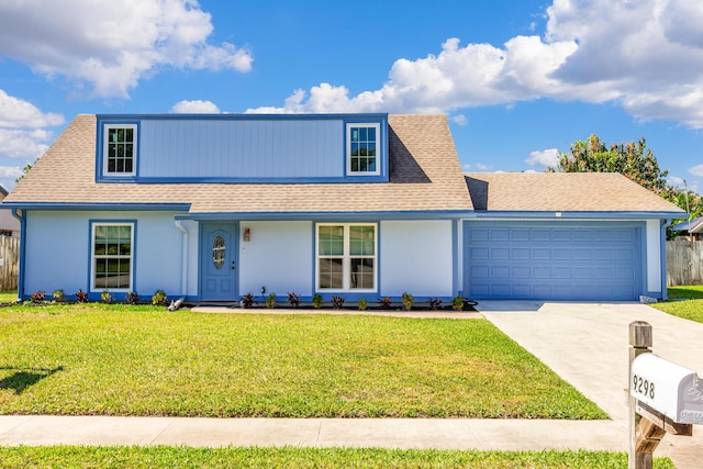 view of front of property with a garage, concrete driveway, a front yard, and roof with shingles