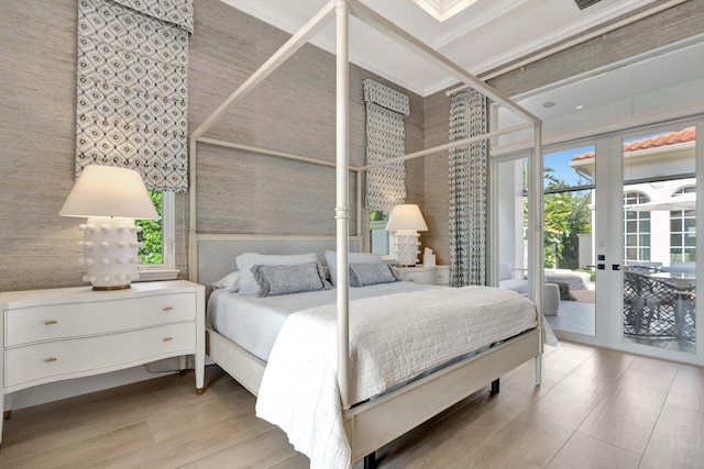 bedroom with light hardwood / wood-style flooring, access to exterior, and french doors