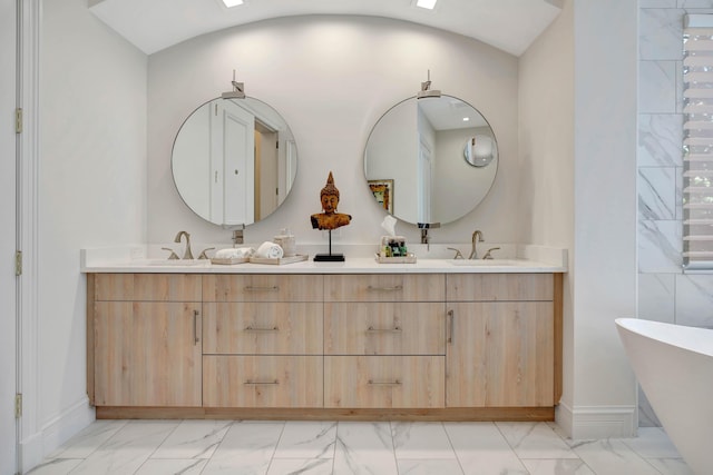 bathroom featuring vanity and a bathtub