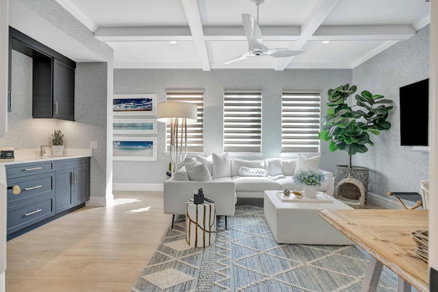 living room with beam ceiling, ceiling fan, coffered ceiling, and light wood-type flooring