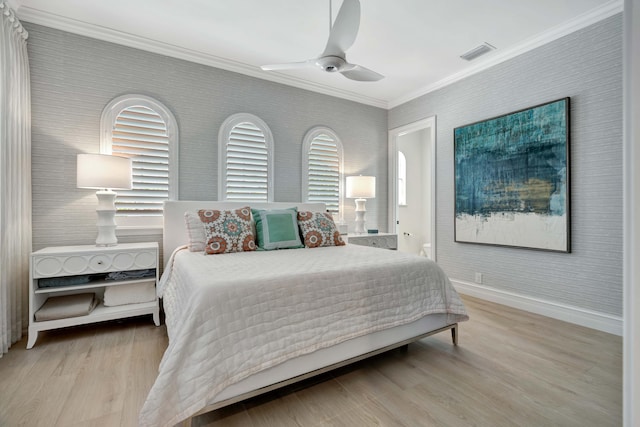 bedroom with crown molding, ceiling fan, and light hardwood / wood-style flooring