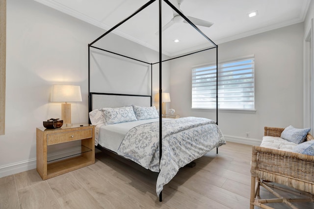 bedroom with ornamental molding and light hardwood / wood-style flooring