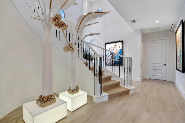 stairway with hardwood / wood-style floors