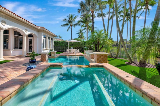 view of swimming pool featuring a patio area