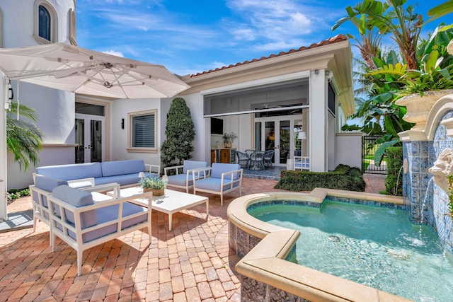 exterior space with a patio, an outdoor hangout area, french doors, and pool water feature