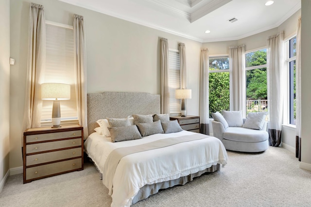 carpeted bedroom with ornamental molding