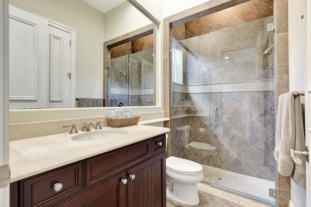 bathroom with vanity, toilet, and walk in shower