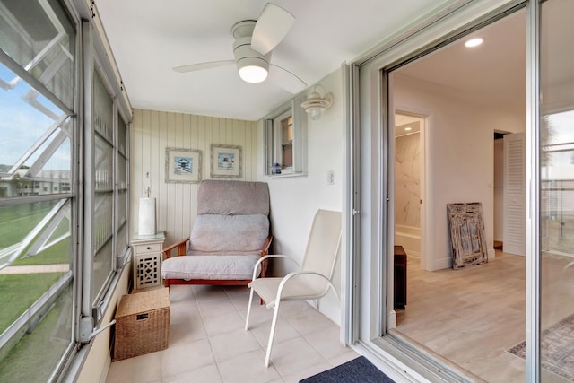 sunroom / solarium with ceiling fan