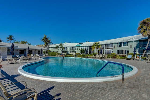 view of pool featuring a patio