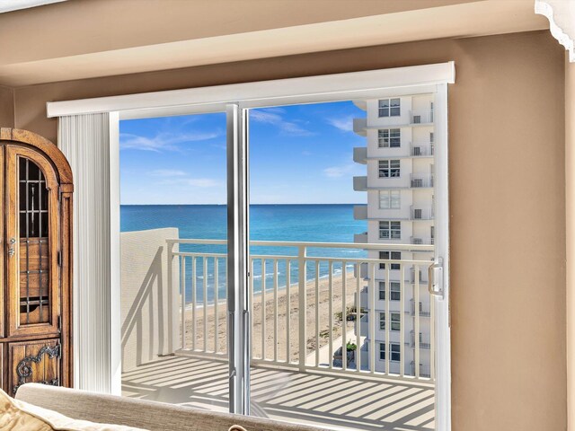 balcony with a beach view and a water view