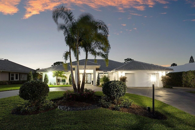 11955 N Lake Dr, Boynton Beach, FL 33436 - ranch-style home with a garage and a yard