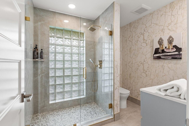 11955 N Lake Dr, Boynton Beach, FL 33436 - bathroom featuring walk in shower, vanity, and toilet