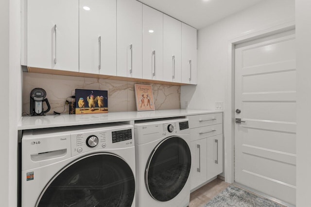 11955 N Lake Dr, Boynton Beach, FL 33436 - laundry room featuring cabinets and independent washer and dryer