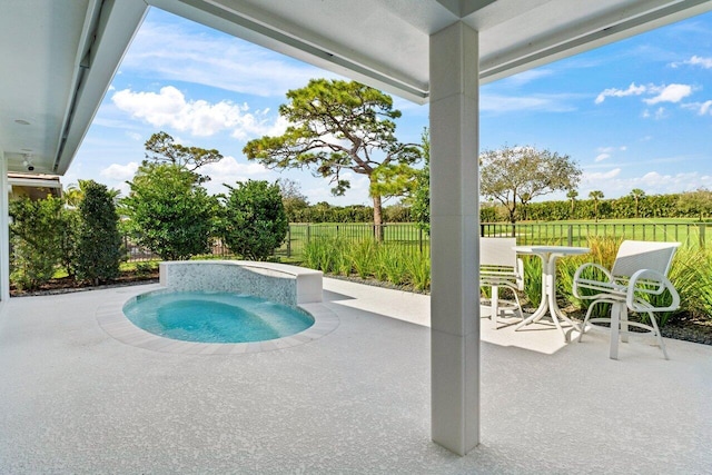 11955 N Lake Dr, Boynton Beach, FL 33436 - view of swimming pool with a jacuzzi and a patio area