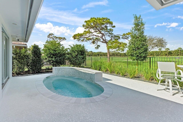 11955 N Lake Dr, Boynton Beach, FL 33436 - view of swimming pool with a patio and an in ground hot tub